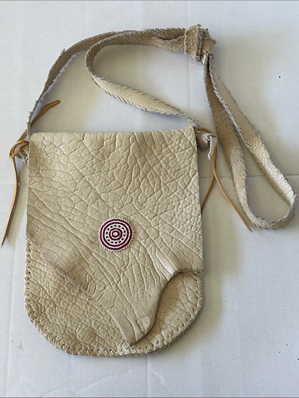 NATIVE AMERICAN HANDMADE BUCKSKIN CROSSBODY BAG WITH BEADED MEDALLION